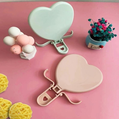 Mujer vestimenta en forma de corazón bolsillo maquillaje ajustable compacto mini espejo con calidad